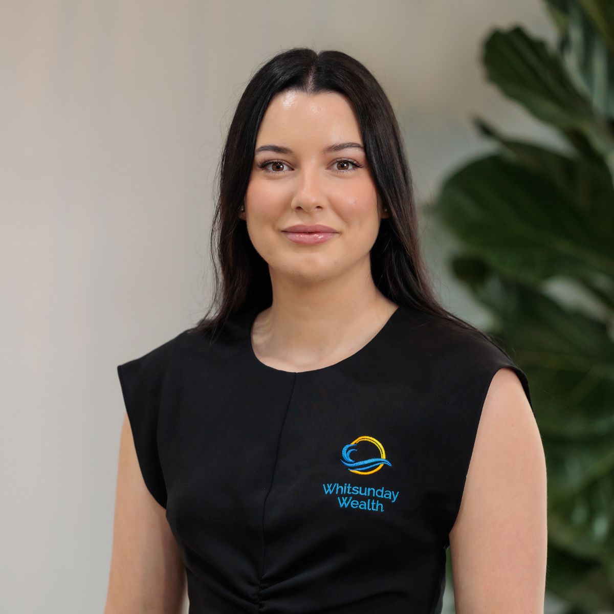Professional headshot of Montana Leotta with plant in background