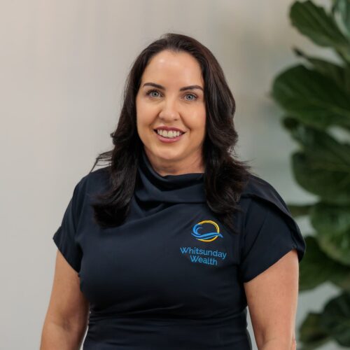 Professional headshot of Kate with plant in background