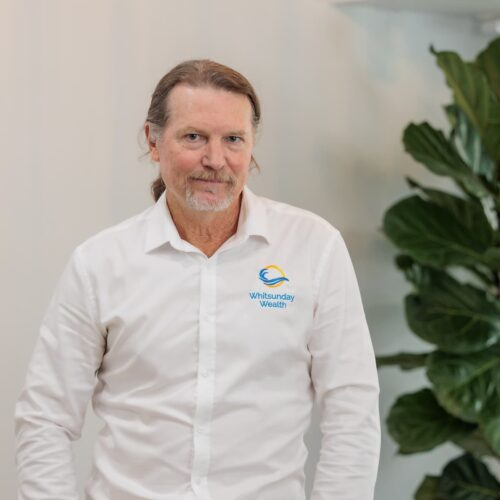 Professional headshot of Kim with plant in background
